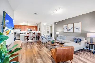a living room with a couch and a table at Vista Cay Magic condo in Orlando