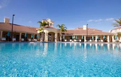 a large swimming pool in front of a hotel at Vista Cay Lakeview Elysium condo in Orlando