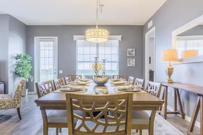 a dining room with a wooden table and chairs at LakeView Penthouse Elegance condo in Orlando