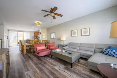 a living room with a couch and a table at Vista Cay Casa Bella townhouse in Orlando