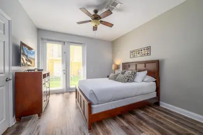 a bedroom with a bed and a ceiling fan at Vista Cay Casa Bella townhouse in Orlando