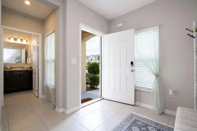 a hallway with a door leading to a bathroom at Stunning 3Bd Close to Disney at Fiesta Key 4764 in Kissimmee