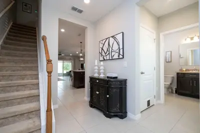 a hallway of a home with a staircase at Stunning 3Bd Close to Disney at Fiesta Key 4764 in Kissimmee