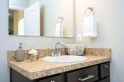 a bathroom with a sink and a mirror at Stunning 3Bd Close to Disney at Fiesta Key 4764 in Kissimmee