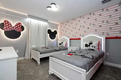 a bedroom with two beds and a wall with butterflies at Gorgeous 4Bd with Pool at Storey Lake Resort 4475 in Kissimmee