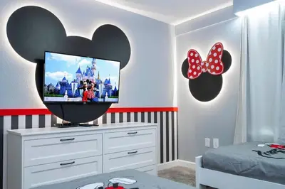 a bedroom with a flat screen tv on a dresser at Gorgeous 4Bd with Pool at Storey Lake Resort 4475 in Kissimmee
