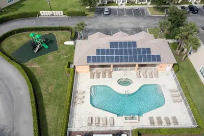 an overhead view of a house with a swimming pool and a solarium at Marvelous 3Bd w Pool Near Disney at Serenity 1536 in Orlando