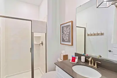 a bathroom with a sink and a shower at 4423 Scene Lane in Kissimmee