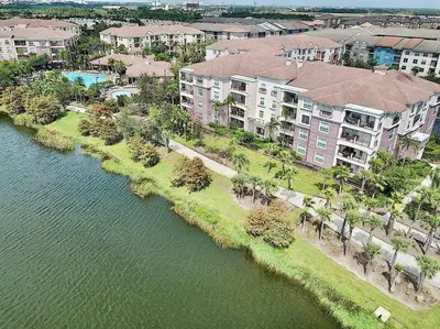 an aerial view of an apartment complex next to a body of water at Vista Cay Luxury Loft in Orlando