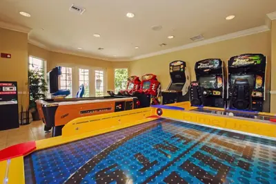a game room with a pool and ping pong tables at Vista Cay - Cosy 3 bedroom condo in Orlando