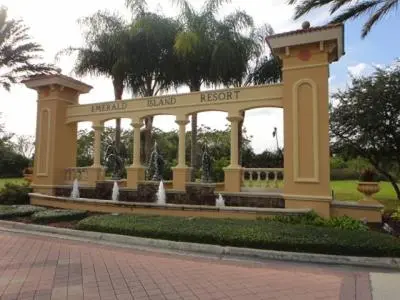 a large building with a fountain in a park at Emerald Escape - New Pool Home in Kissimmee