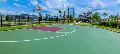 a basketball court in a park with a basketball hoop at Charming Holiday Condo, Only 7 min to Disney in Kissimmee