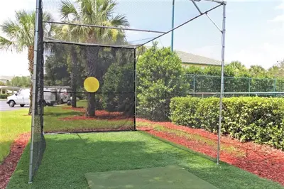 a net with a frisbee in a yard at 2BR2BA Getaway 7 Miles from Orlando Parks in Kissimmee