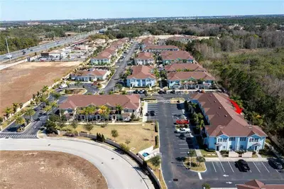 an aerial view of a resort with a parking lot at Modern Family-Friendly Townhome – 10 Min Parks in Kissimmee