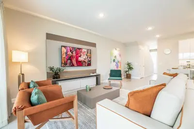 a living room with a couch and a table at 7992 Cozy 5BD Disney Getaway with Pool in Orlando