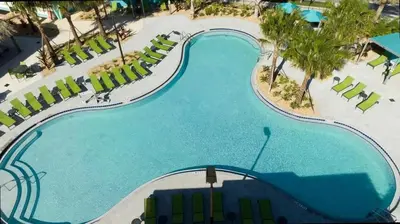 an overhead view of a swimming pool at a resort at Splendid 5Bd Close to Disney at Storey Lake 4251 in Kissimmee