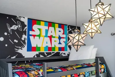 a bedroom with a star wars banner and a bed at Gorgeous 4 Bd w Pool at Storey Lake Resort 4277 in Kissimmee