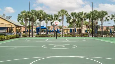 a basketball court with a basketball hoop at Near Disney - 5BR Home- Games Pool Hot Tub & BBQ in Kissimmee