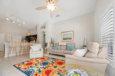 a living room with a couch and a table at Private Oasis in Kissimmee - Pool, BBQ, Free Parking in Orlando