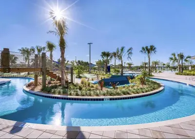 a pool at a resort with palm trees at Storey Lake Resort, Private Pool, And Much More!! in Kissimmee