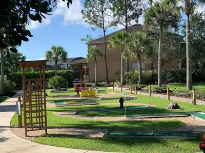 a playground with play equipment in a park at Restful 4BR 3BA with BBQ, Heated Pool & SPA in Kissimmee