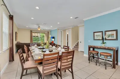 a dining room with a table and chairs at 450 Paradise 8BD Villa- Game Room PoolSpa in Orlando