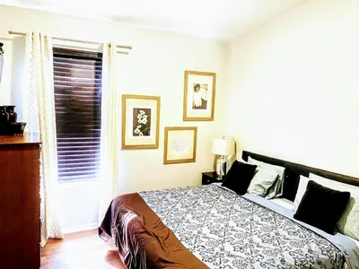 a bedroom with a bed and a window at Family Friendly Disney Villa (4 Miles from Disney) in Kissimmee
