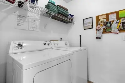 a white washer and dryer in a room at 2974 Viscount Villa 3bed+ Pool&Spa in Kissimmee