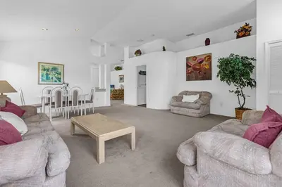 a living room with two couches and a table at 2974 Viscount Villa 3bed+ Pool&Spa in Kissimmee