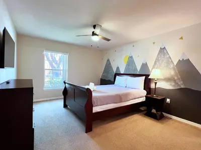 a bedroom with a bed with a mountain mural on the wall at Lovely 3-Bedroom Pool Villa-1445SCD in Orlando