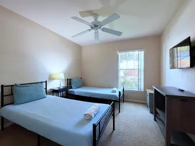 a bedroom with two beds and a ceiling fan at Lovely 3-Bedroom Pool Villa-1445SCD in Orlando
