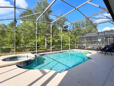 a swimming pool in a building with a glass roof at Beautiful 6Bd Pool Hm Veranda Palms-4464NP in Kissimmee