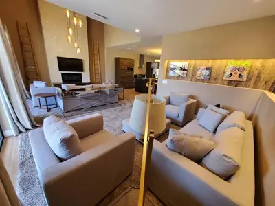 a living room with two couches and a tv at 7594 Magic Village 3suites 6guets 8 min Disney in Orlando