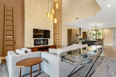a living room with a white couch and a table at 7594 Magic Village 3suites 6guets 8 min Disney in Orlando
