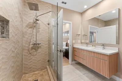 a bathroom with a shower and a sink at 7583 Magic Village jacuzzi 3 suites near 192 and Disney in Orlando