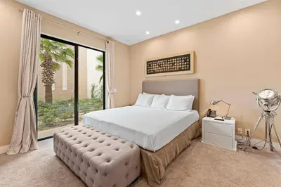 a bedroom with a bed and a large window at 3045 Magic Village8 guests 4 suites BBQ 8 min Disney in Orlando