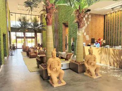 a lobby with two statues in the middle of it at 3053 Magic Village 3 suites jacuzzi BBQ 6min Disney in Orlando