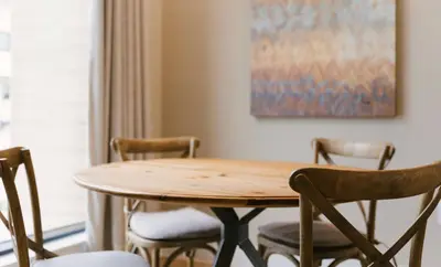 a dining room table with chairs and a painting at 7562 Magic Village nice 8guests 4suites 8 min Disney in Orlando