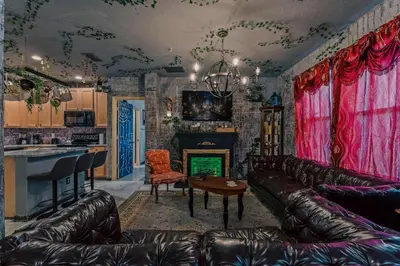 a living room with leather furniture and a fireplace at Stay at Hogwarts Harry Potter's Home, Free Parking, Pets Allowed in Kissimmee