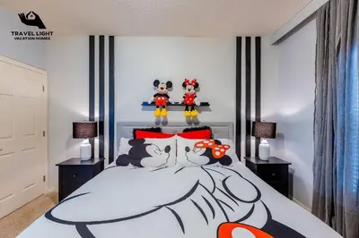 a bedroom with a bed with hello kitty decorations on it at Themed Home Near Disney World in Kissimmee