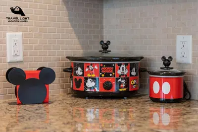 two drums with hello kitty stickers on them on a counter at Themed Home Near Disney World in Kissimmee