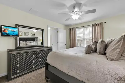 a bedroom with a bed and a ceiling fan at 2574 Archfeld in Kissimmee