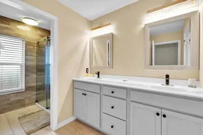 a bathroom with two sinks and a shower at 2574 Archfeld in Kissimmee