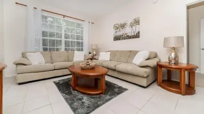 a living room with two couches and a table at 2774 Almaton #204 in Kissimmee