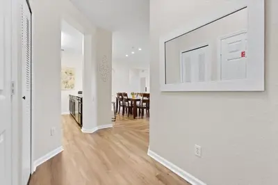 a room with a white wall with a picture on the wall at 2774 Almaton #403 in Kissimmee
