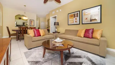 a living room with two couches and a table at 2781 Almaton #103 in Kissimmee