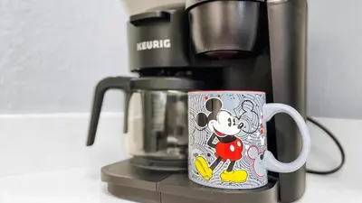 a coffee maker with a mickey mouse coffee cup at 2788 Almaton #301 in Kissimmee