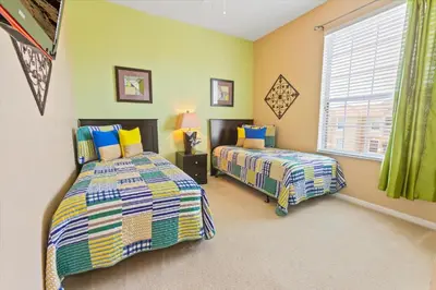 a bedroom with two beds and a window at 2813 Almaton #403 in Kissimmee