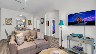 a living room with a couch and a table at 2302 Butterfly Palm #203 in Kissimmee