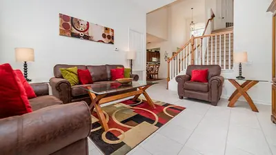 a living room with two couches and a table at 7795 Basnett in Kissimmee